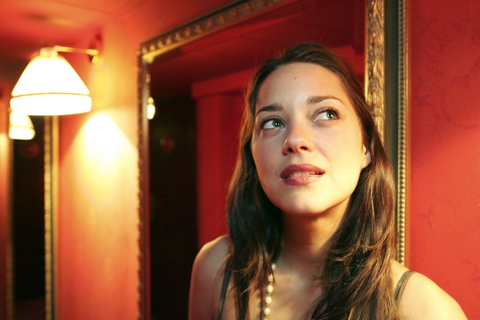 Marion Cotillard in a red room