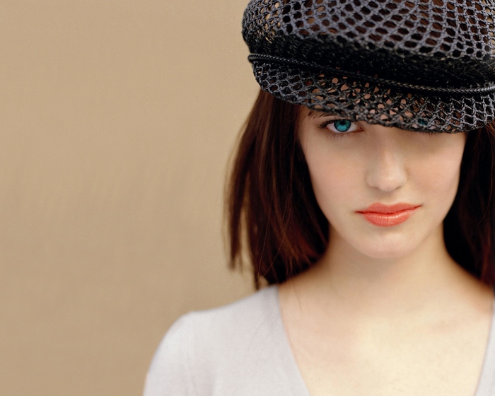 Eva Green wearing a black cap