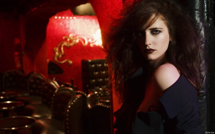 Eva Green in a dark, ornate setting
