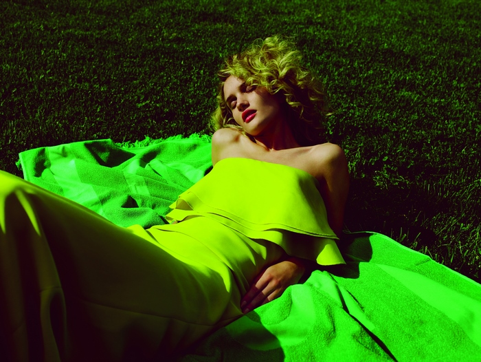 Rosie Huntington-Whiteley lying on grass