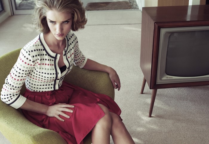 Rosie Huntington-Whiteley sitting in a chair