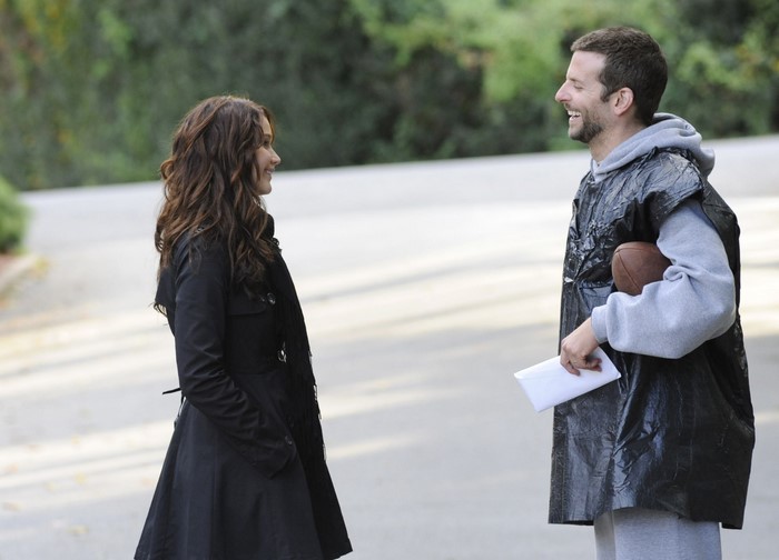 Bradley Cooper and woman outdoors