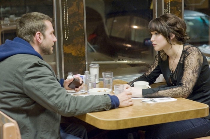 Bradley Cooper and Jennifer Lawrence in a diner