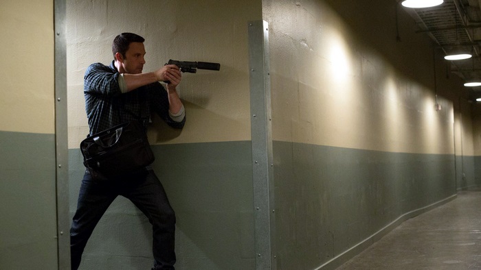 Ben Affleck holding a gun