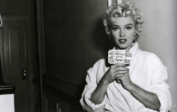 Marilyn Monroe holding a slate