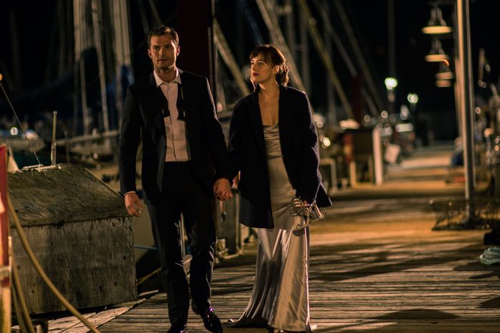 Dakota Johnson and Jamie Dornan walking at night