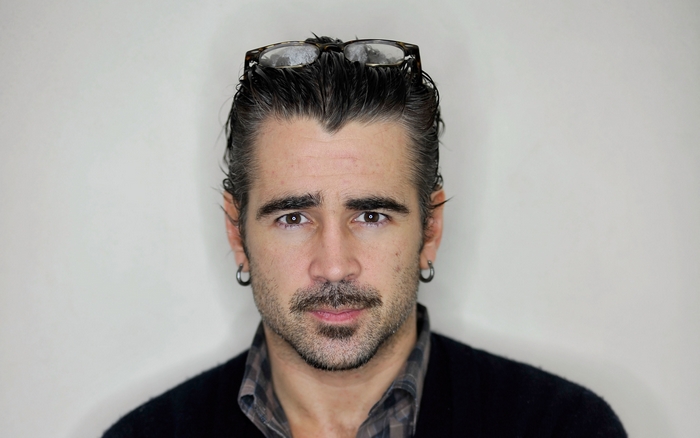 Colin Farrell with glasses on his head