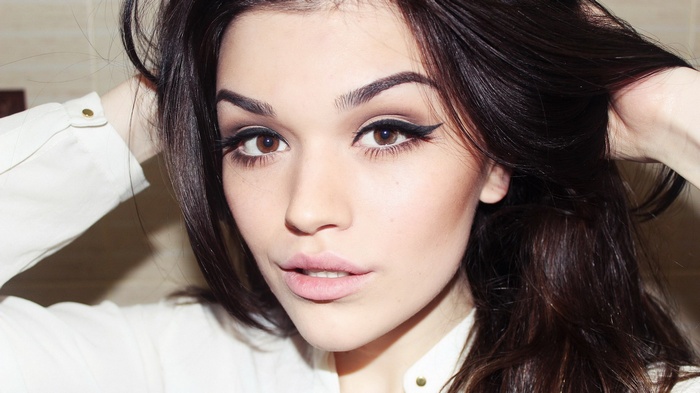 Woman with dark hair and makeup