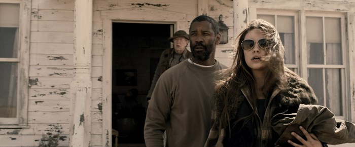 Denzel Washington and woman in front of house