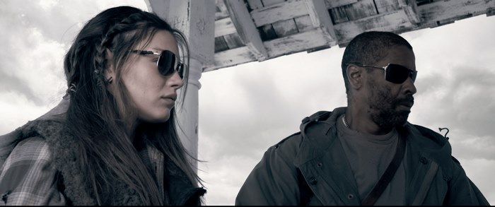 Denzel Washington and a woman in sunglasses