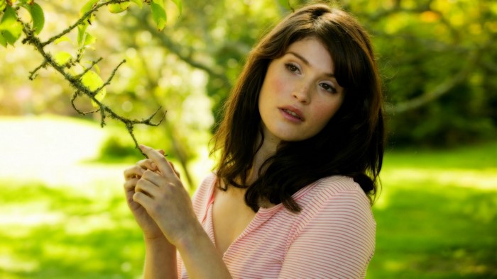 Gemma Arterton in Pink Striped Top Holding Tree Branch