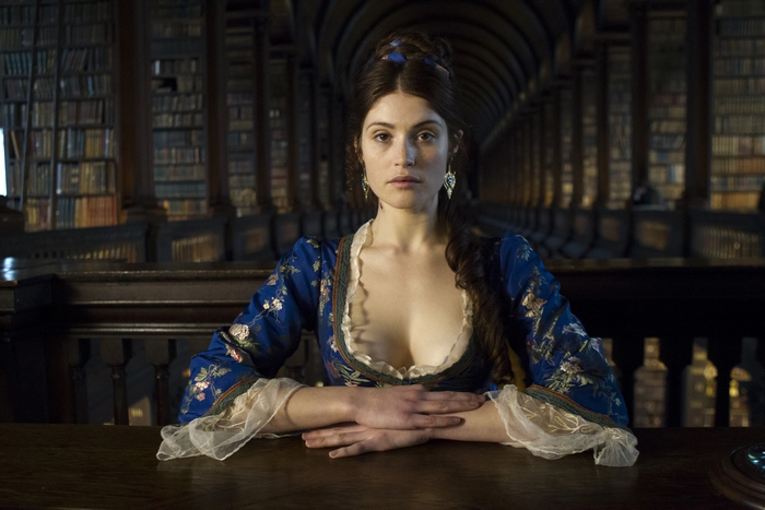 Gemma Arterton in Blue Historical Dress in Elegant Library