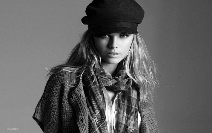Karlie Kloss wearing a cap and scarf