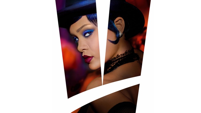 Rihanna in a black hat with blue hair