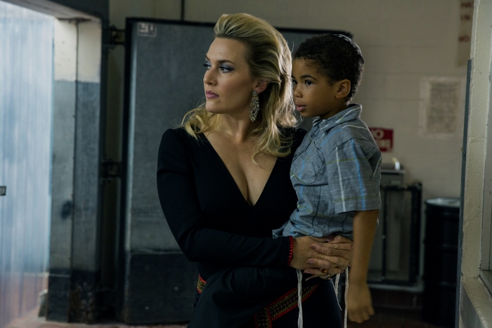 Kate Winslet holding a child