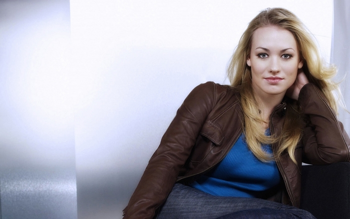 Yvonne Strahovski sitting on a chair
