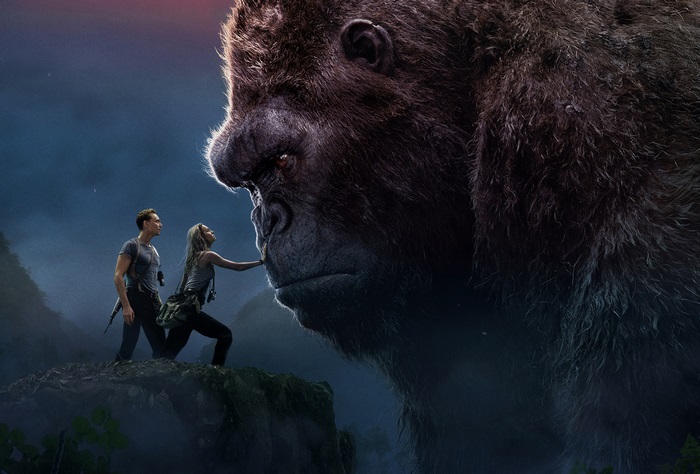 Kong and two humans on a cliff