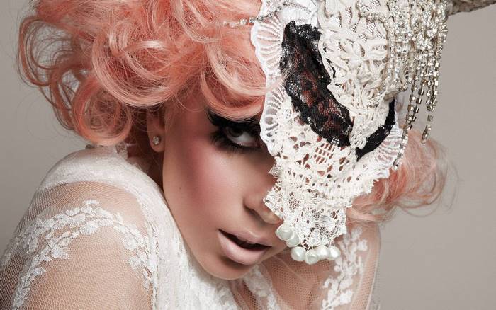 Lady Gaga with pink hair and lace mask