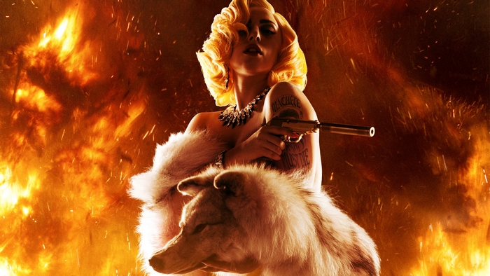 Lady Gaga with a gun and a wolf