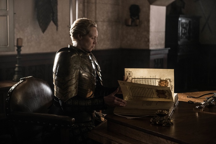 Brienne of Tarth from Game of Thrones reading a book