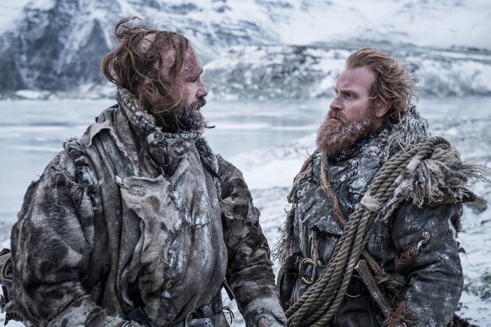 Two men in winter clothing in a snowy landscape