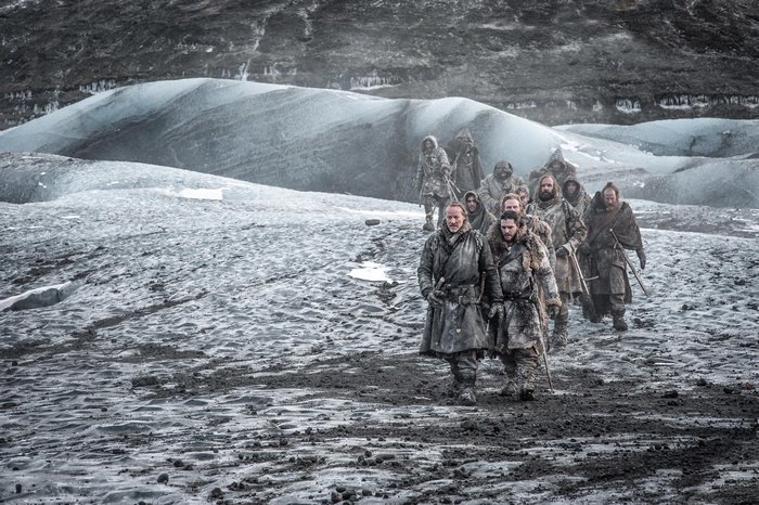 Group of people walking on a glacier