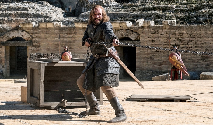 The Hound from Game of Thrones pulling chains