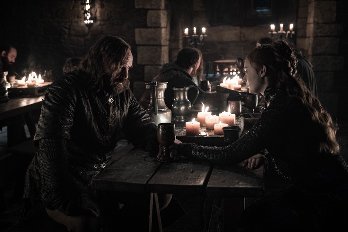 Rory McCann and Sansa Stark at a table