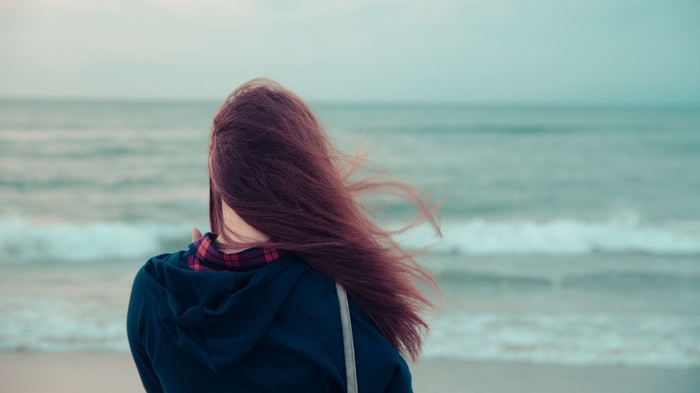 Woman with long hair on a beach