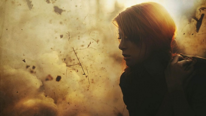 Woman in silhouette with sunlight and dust