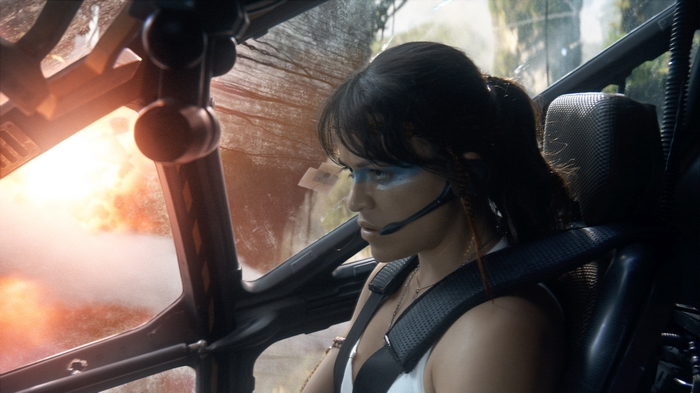 Michelle Rodriguez in a cockpit with explosion