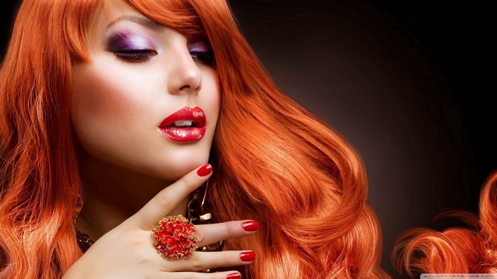 Woman with red hair and makeup