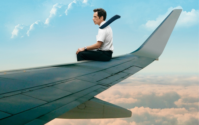 Ben Stiller sitting on airplane wing