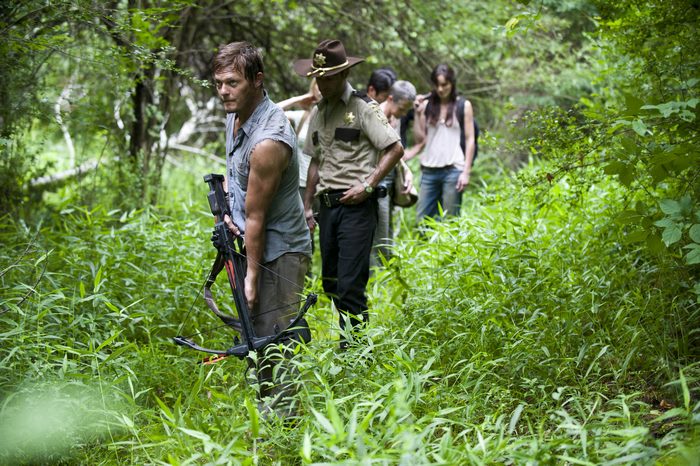 Norman Reedus and group in forest
