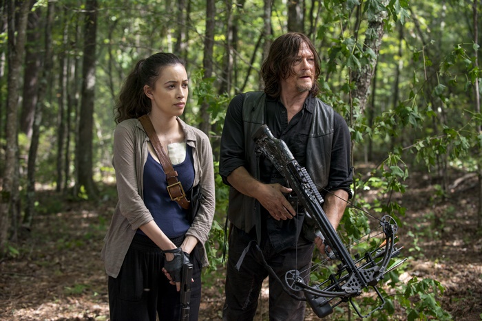 Norman Reedus and woman in forest