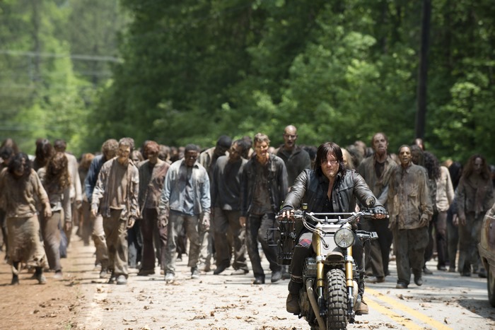 Norman Reedus on a motorcycle with zombies