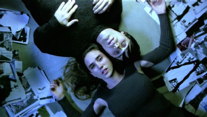 Jennifer Connelly and Jared Leto lying on floor with photos