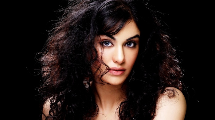 Woman with dark curly hair