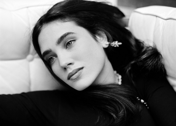 Jennifer Connelly on a white couch