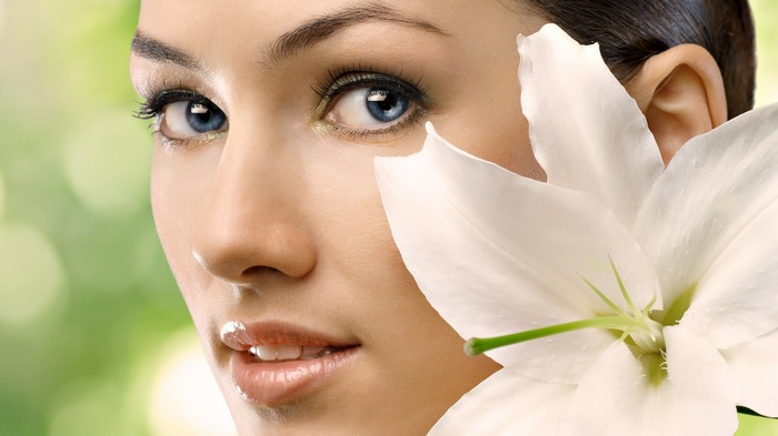 Woman with white lily flower