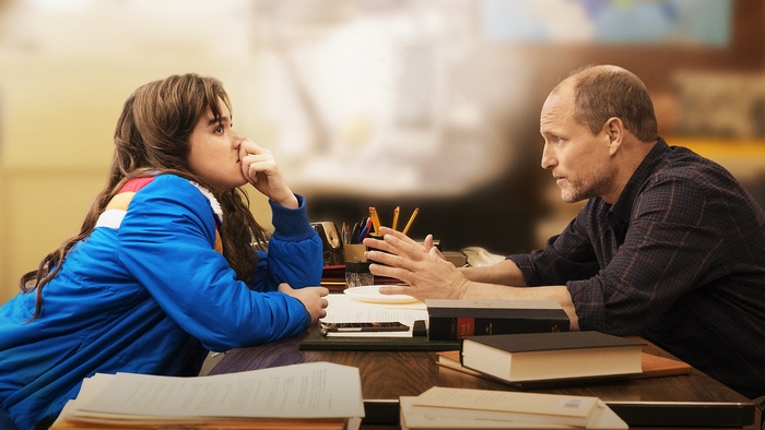 Woody Harrelson and a young woman at a desk