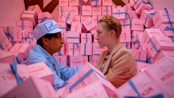 Saoirse Ronan in a room full of Mendl's boxes