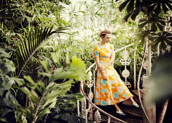 Saoirse Ronan in a floral dress on a staircase