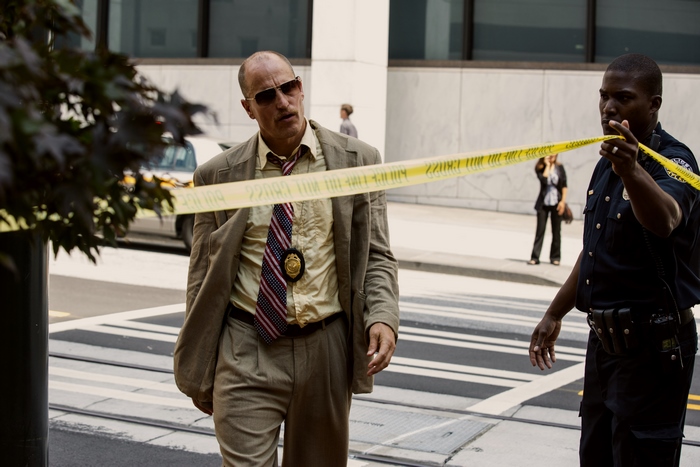 Woody Harrelson as a detective at a crime scene