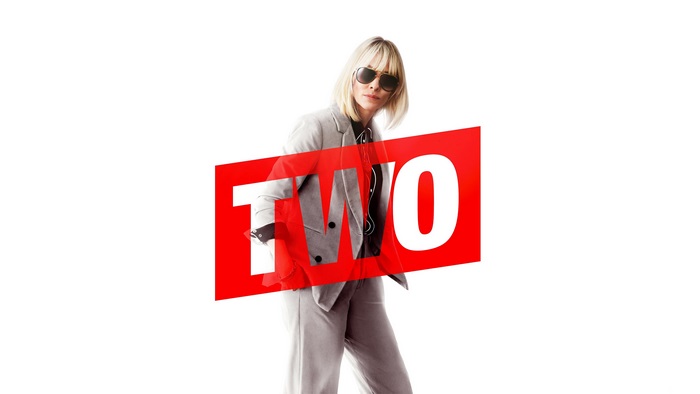 Cate Blanchett in a suit with the word TWO