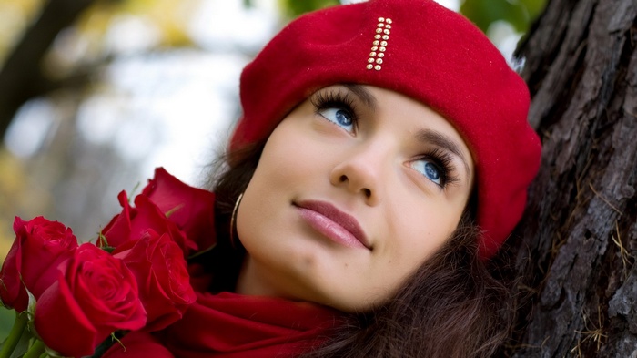 Woman in red beret with red roses