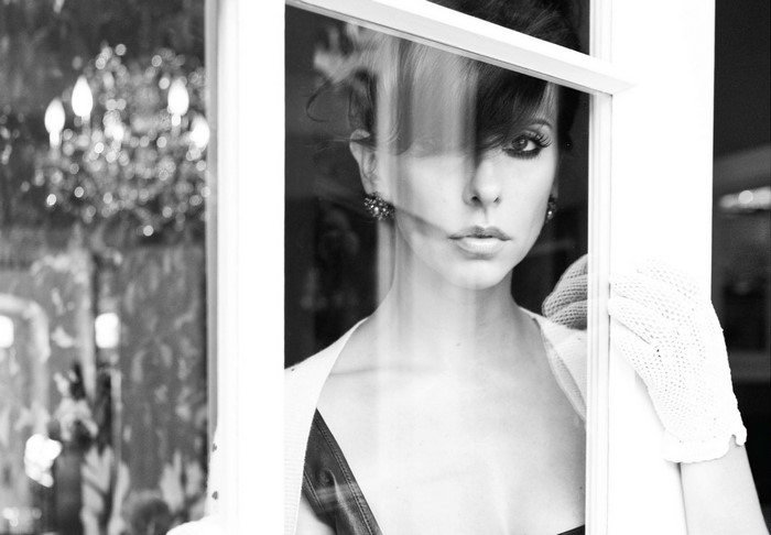 Jennifer Love Hewitt looking through a window