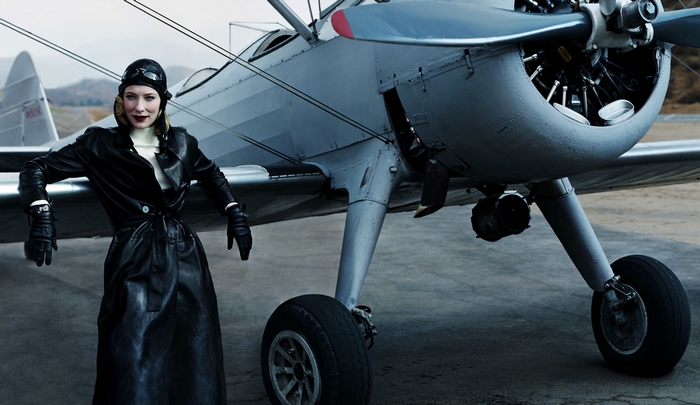 Cate Blanchett in aviator outfit with vintage airplane