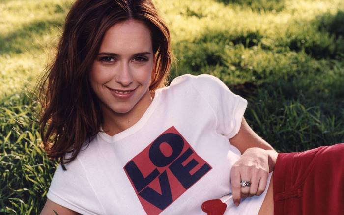 Jennifer Love Hewitt lying on grass