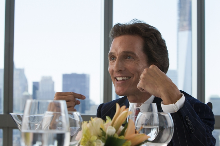 Matthew McConaughey at a table with city view